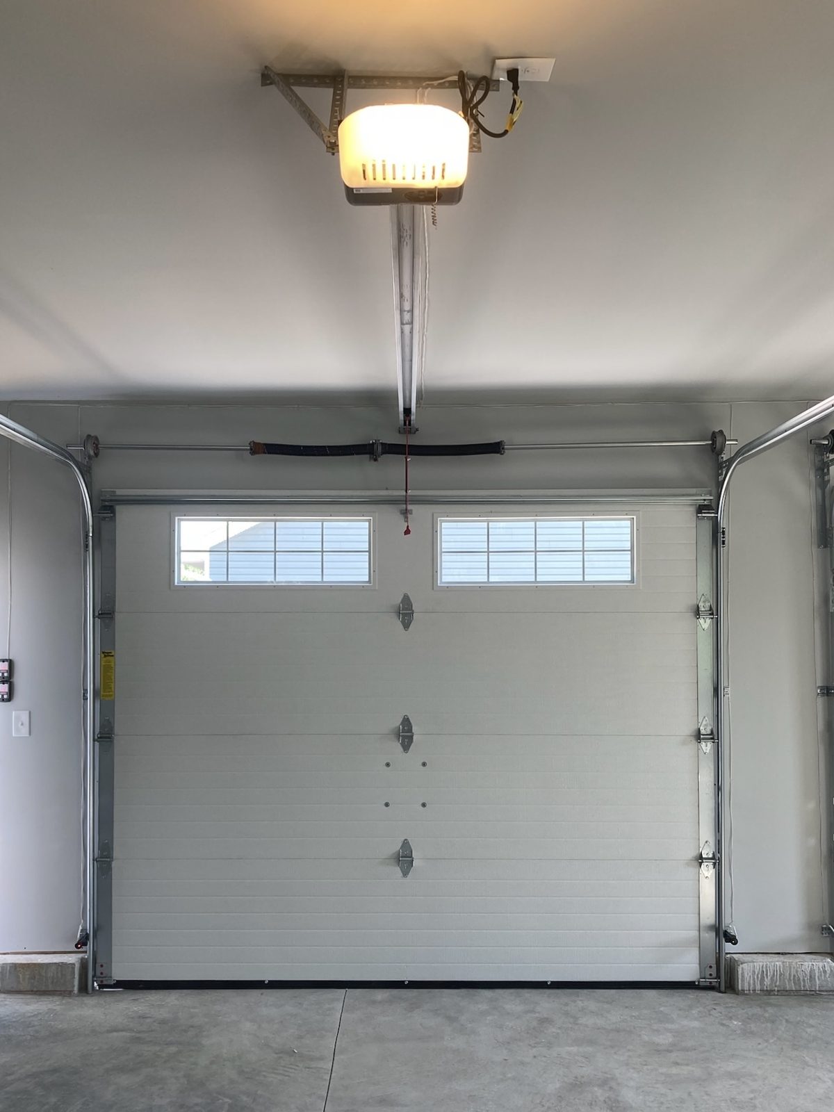 Garage door opener and door installed